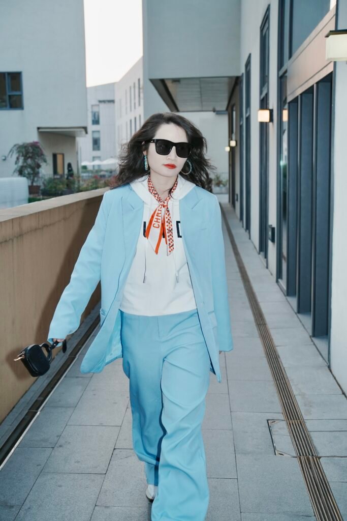 Amanda Zhang writing in soft morning light, surrounded by books, candles, and scent bottles — an intimate portrait of creative reflection and modern branding philosophy