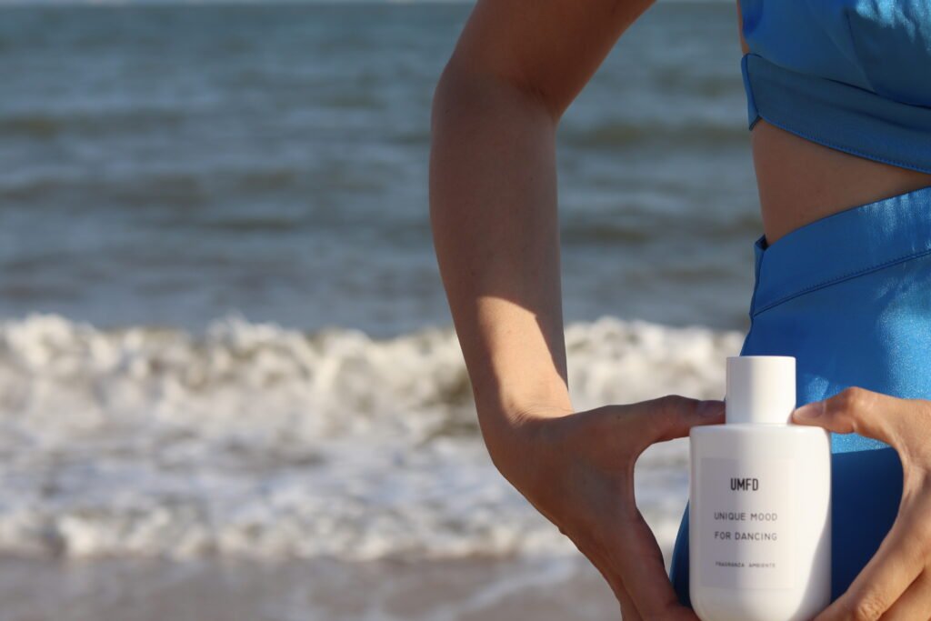 Amanda holding a UMFD reed diffuser bottle